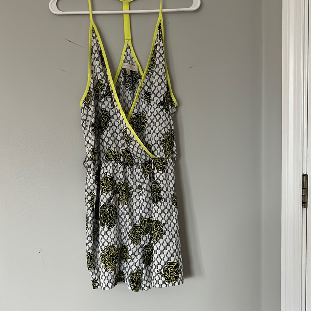 Neon, yellow, black, and white flower romper
